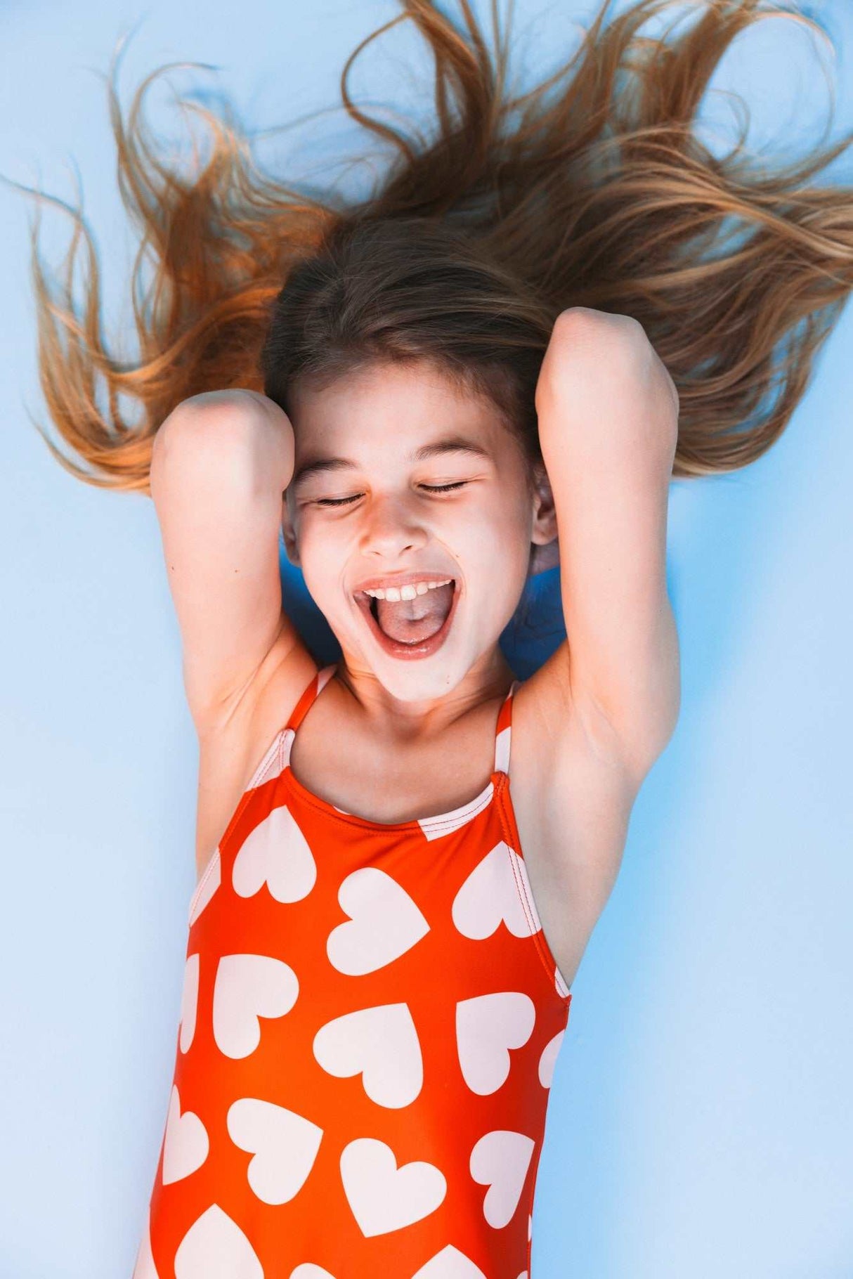 Badeanzug/ Herzchen 110/116