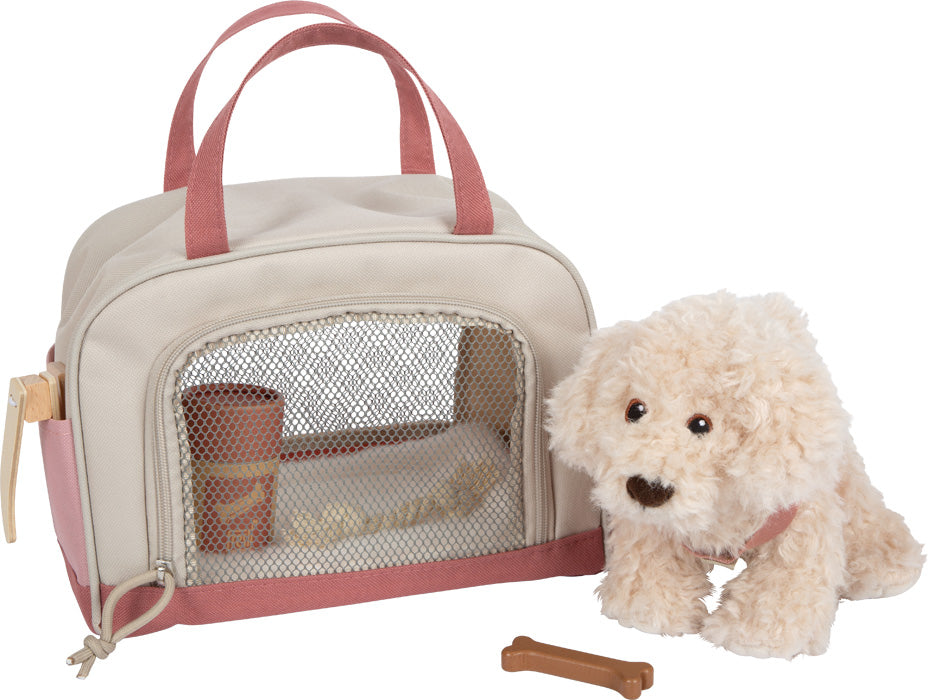 Hund mit Tasche und Pflege-Set