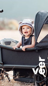 a woman sitting on a boat with a child 