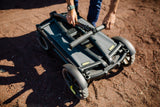 a close up of a motorcycle on a dirt ground 