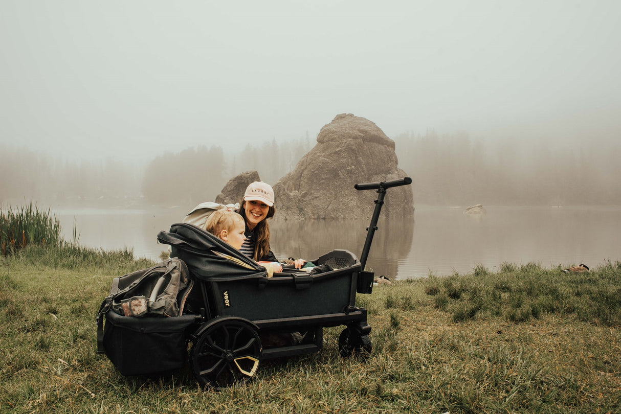 a man and woman sitting on a small boat 